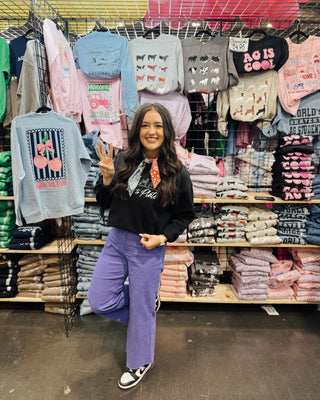 Kodye posing at a show for Wandering Maverick Boutique